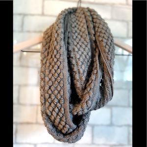 Grey knotted continuous scarf